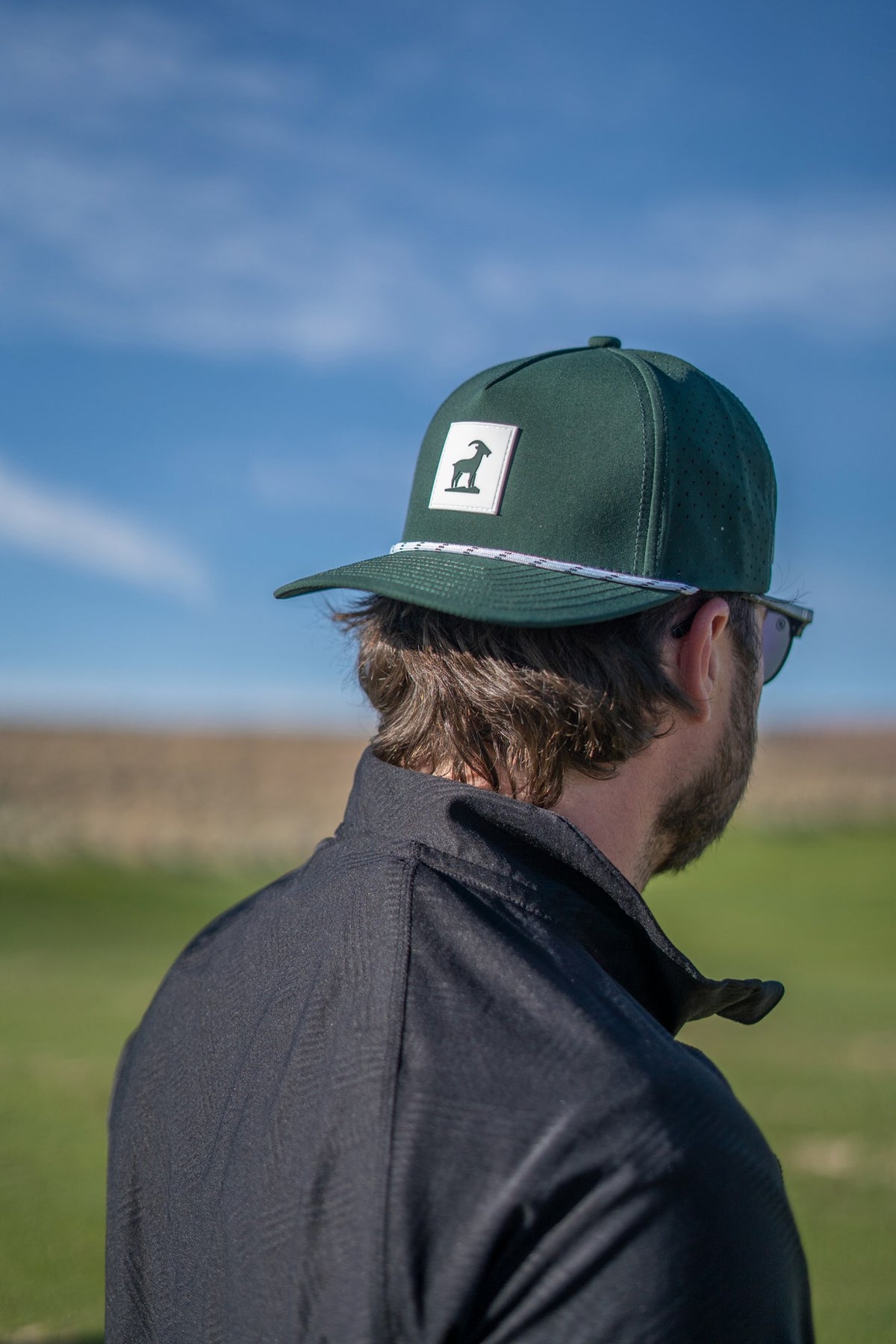 Forest Green Iron Goat Hat worn backwards