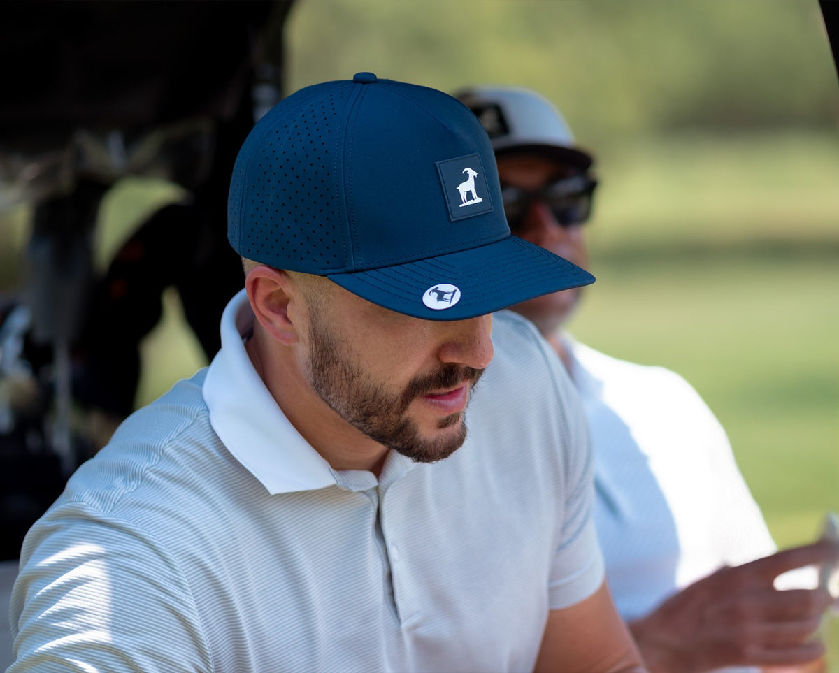 Navy Iron Goat Hat with the ball marker on its brim