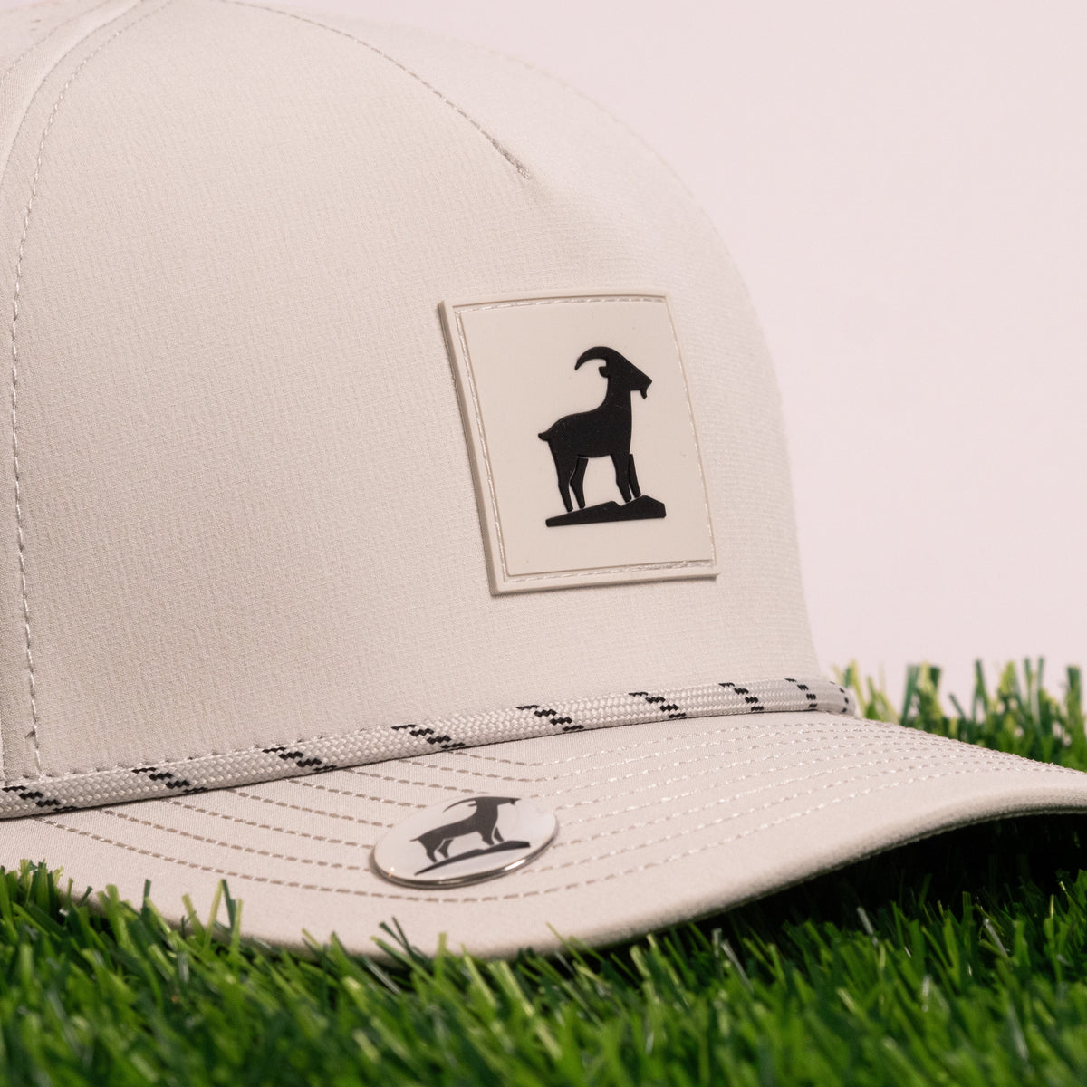 GOAT ball marker on the brim of Kabra’s Iron Goat Hat in Haze